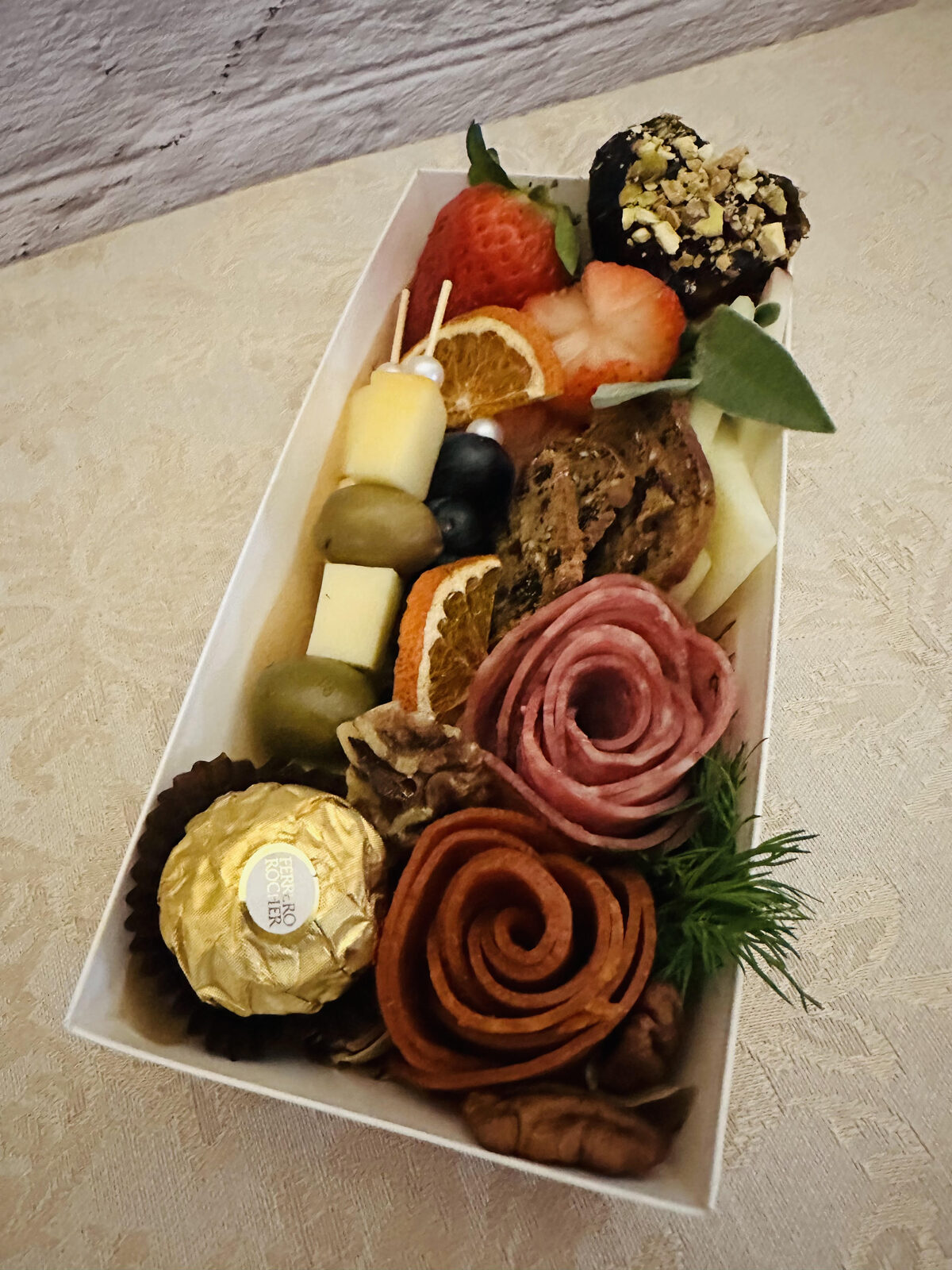 Personal charcuterie box with salami rose and strawberries