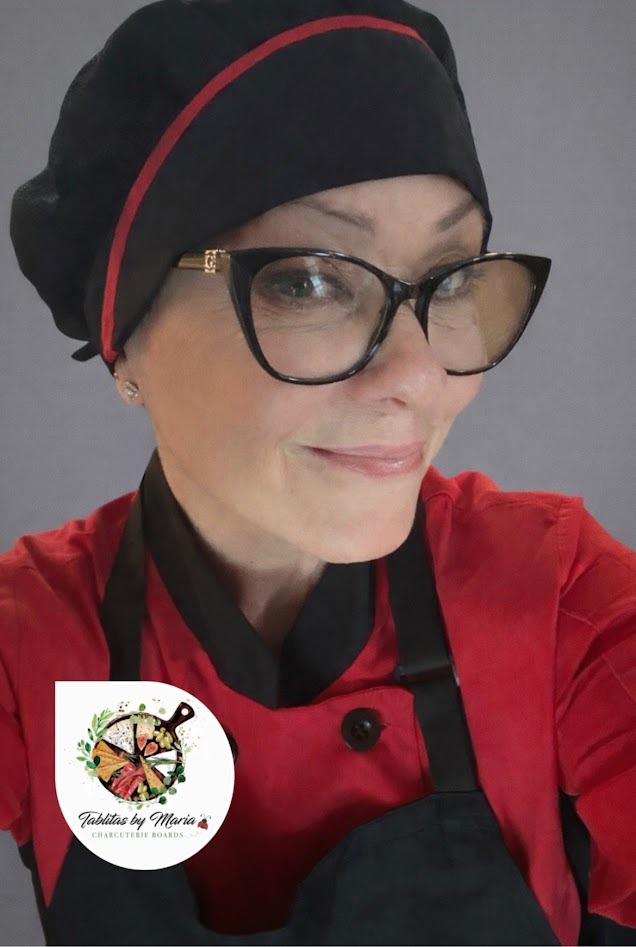Maria in chef attire with Tablitas logo